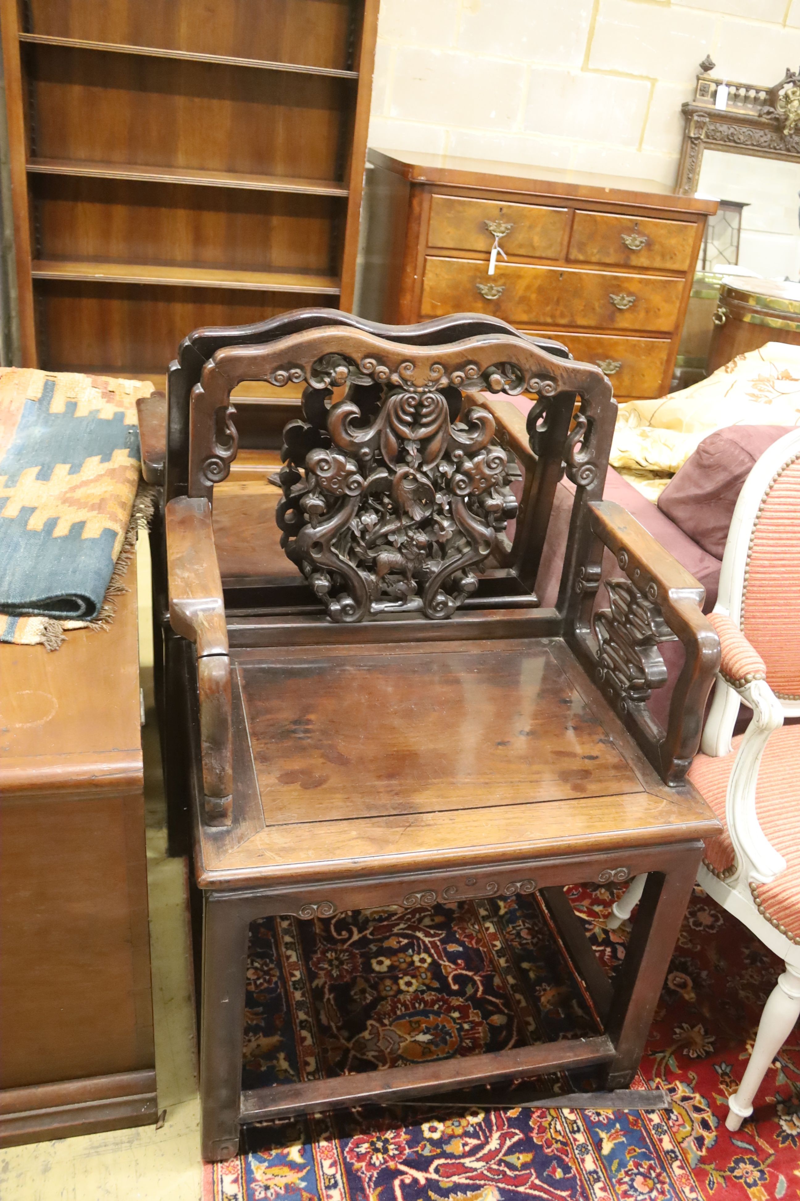 A pair of Chinese carved hongmu elbow chairs (a.f.), width 65cm, depth 48cm, height 96cm